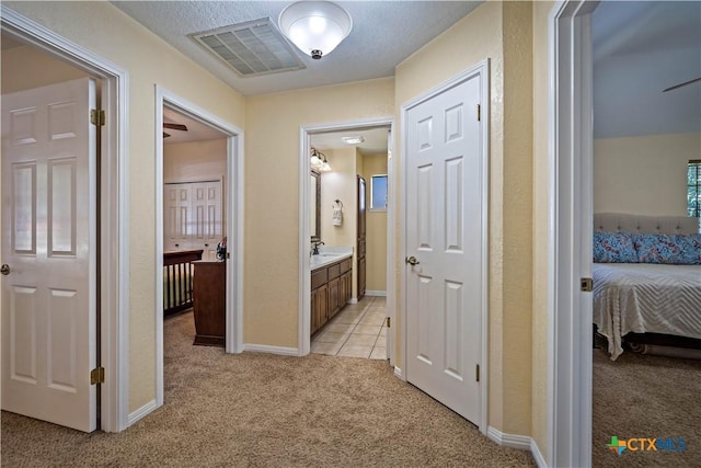 103 River Mdw, Castroville, TX 78009 - hall with light colored carpet and baseboards
