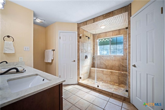 103 River Mdw, Castroville, TX 78009 - bathroom featuring a shower stall, tile patterned floors, and double vanity