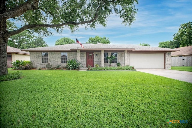 1617 Avalon St, Port Lavaca, TX 77979 - ranch-style house featuring an attached garage, brick siding, and driveway