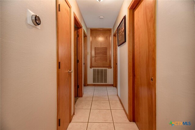 1617 Avalon St, Port Lavaca, TX 77979 - hallway featuring light tile patterned floors and baseboards