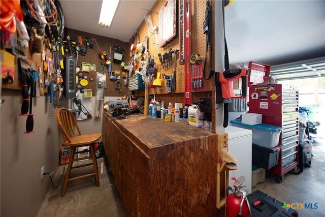 1617 Avalon St, Port Lavaca, TX 77979 - bar featuring a workshop area and concrete flooring