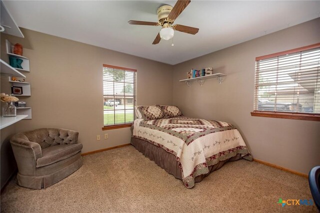 1617 Avalon St, Port Lavaca, TX 77979 - carpeted bedroom featuring baseboards and ceiling fan