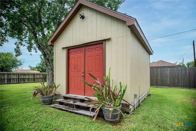 1617 Avalon St, Port Lavaca, TX 77979 - view of shed featuring a fenced backyard and entry steps