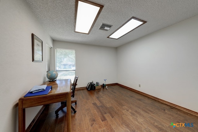 office with a textured ceiling and hardwood / wood-style flooring