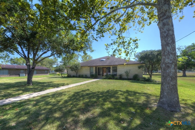 ranch-style home featuring a front yard