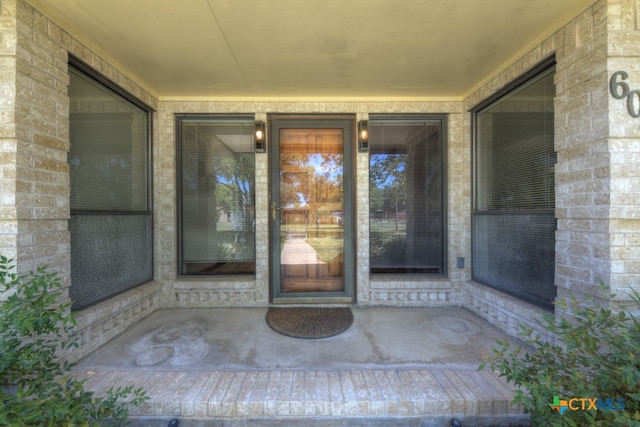 doorway to property with a patio