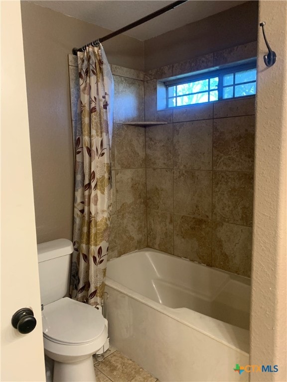 bathroom featuring toilet, shower / bathtub combination with curtain, and tile patterned floors