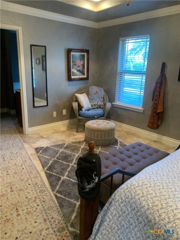 bedroom with baseboards and crown molding