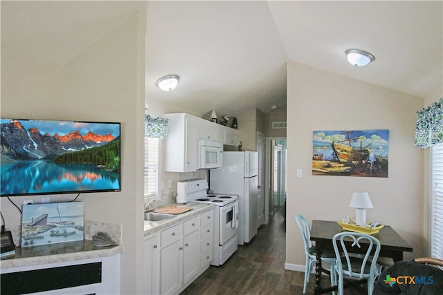 kitchen with white cabinetry, dark wood-type flooring, white appliances, and vaulted ceiling