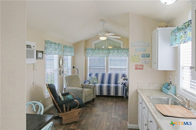 kitchen featuring sink, ceiling fan, dark hardwood / wood-style floors, white cabinets, and vaulted ceiling