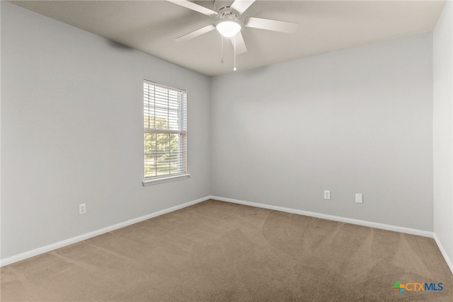 carpeted empty room with ceiling fan