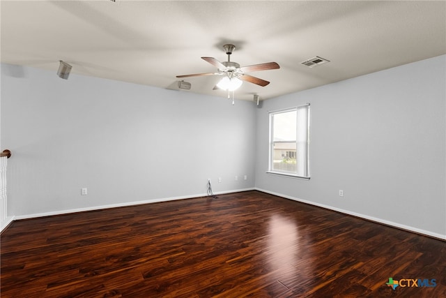 unfurnished room featuring dark hardwood / wood-style floors and ceiling fan