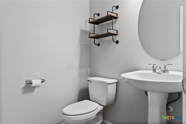 bathroom featuring toilet