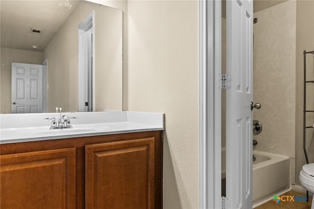 full bathroom featuring tile patterned floors, vanity, toilet, and shower / tub combination