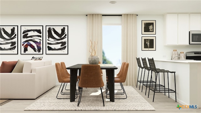 dining room with light wood-style floors