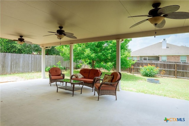 1764 Lower Forty, New Braunfels, TX 78130 - fenced backyard featuring a ceiling fan, outdoor lounge area, and a patio area