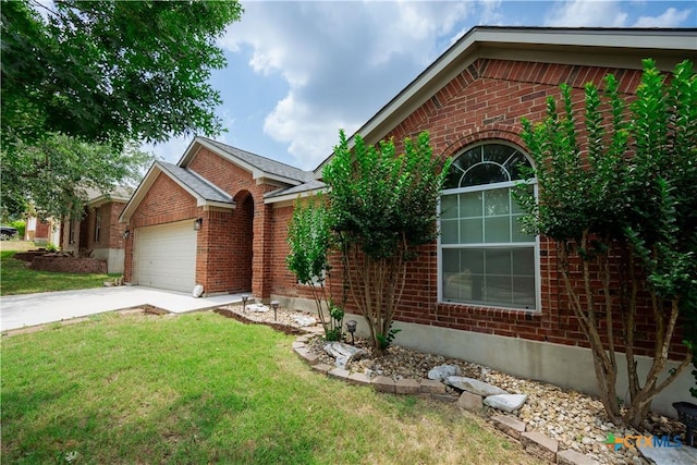 1764 Lower Forty, New Braunfels, TX 78130 - ranch-style home featuring brick siding, a garage, a front lawn, and driveway