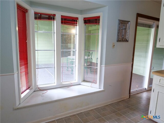 interior space featuring baseboards