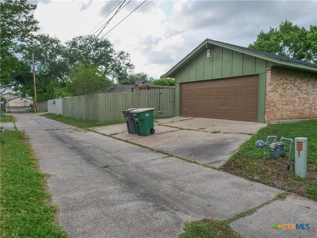 garage featuring fence