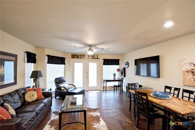 living room with french doors and ceiling fan