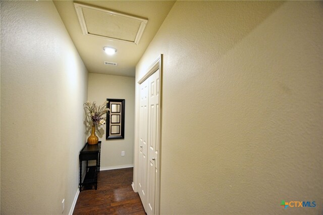 corridor with dark wood-type flooring