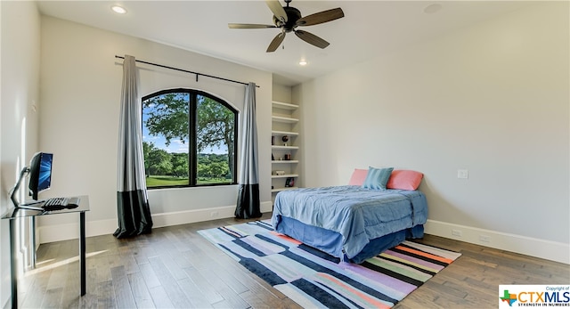 bedroom featuring dark wood-type flooring and ceiling fan