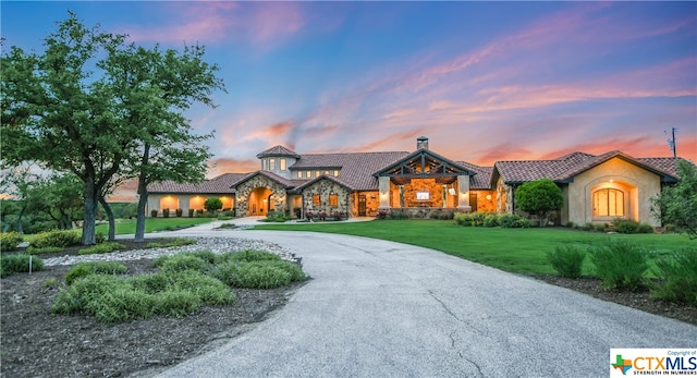 view of front of home with a lawn