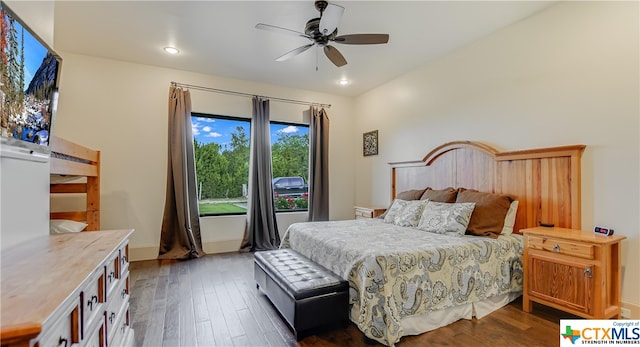 bedroom with hardwood / wood-style flooring and ceiling fan