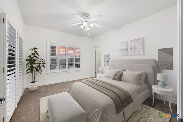 bedroom featuring ceiling fan and carpet