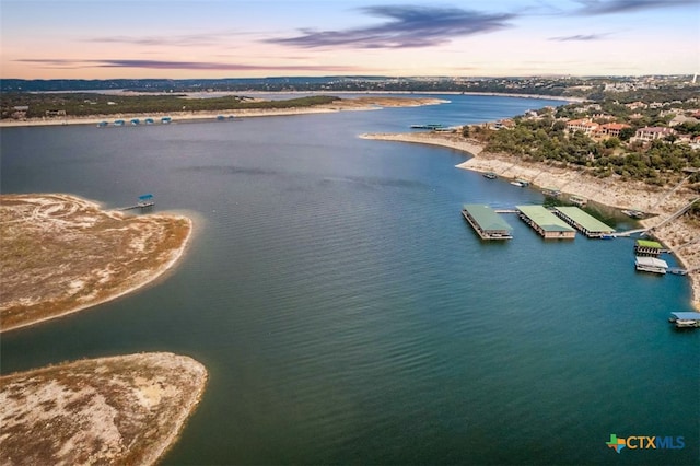 aerial view at dusk with a water view