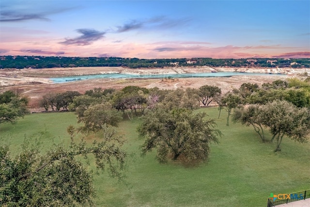 aerial view at dusk with a water view