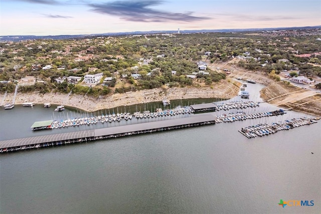 aerial view at dusk with a water view