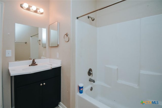 bathroom with vanity and bathtub / shower combination