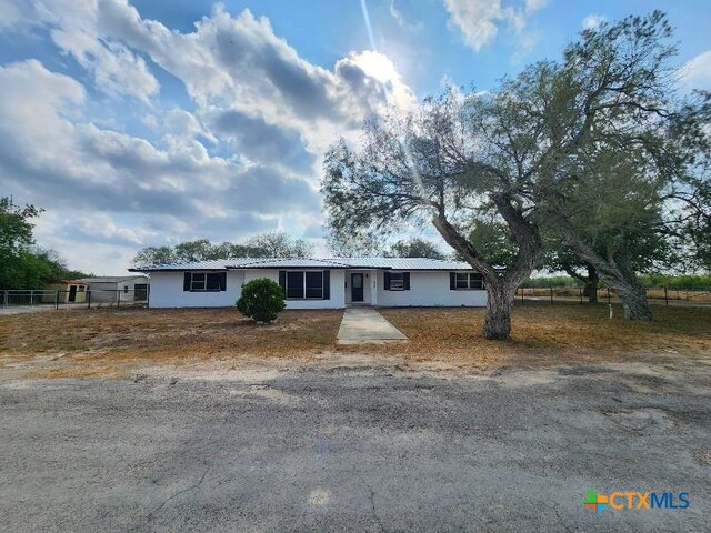 single story home with fence