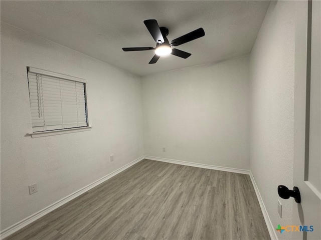 empty room with light hardwood / wood-style flooring and ceiling fan