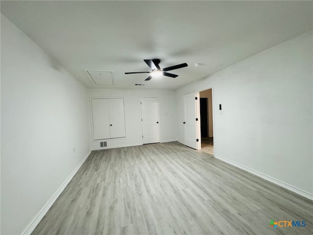 unfurnished bedroom featuring light wood-type flooring and ceiling fan