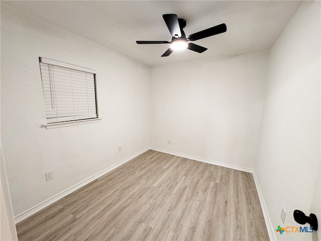 unfurnished room featuring ceiling fan and light hardwood / wood-style flooring