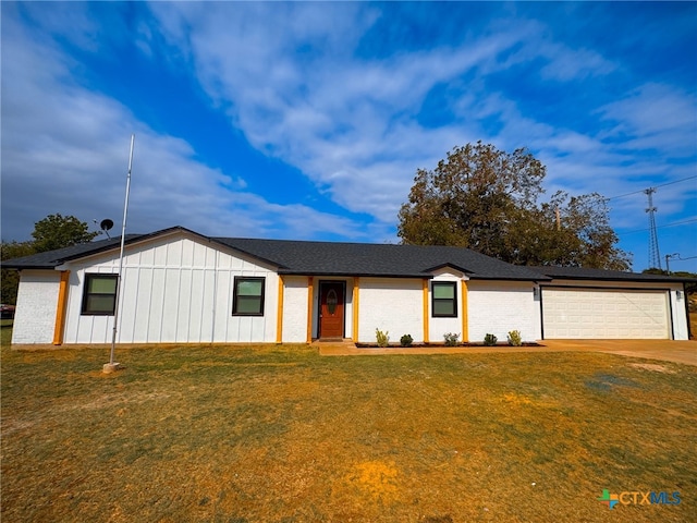 ranch-style house with a garage and a front yard