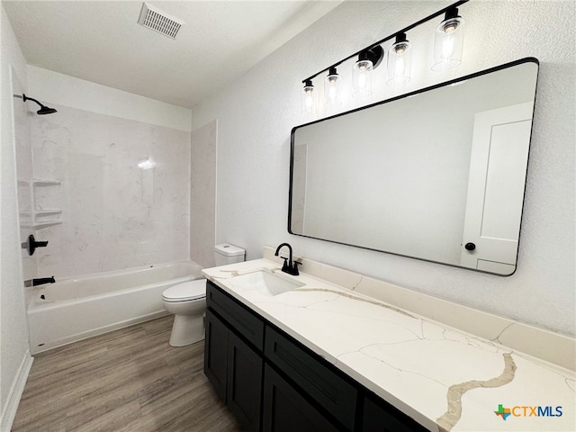 full bathroom with toilet, bathtub / shower combination, vanity, and hardwood / wood-style flooring