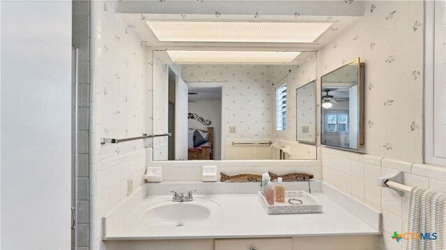 bathroom featuring vanity and ceiling fan