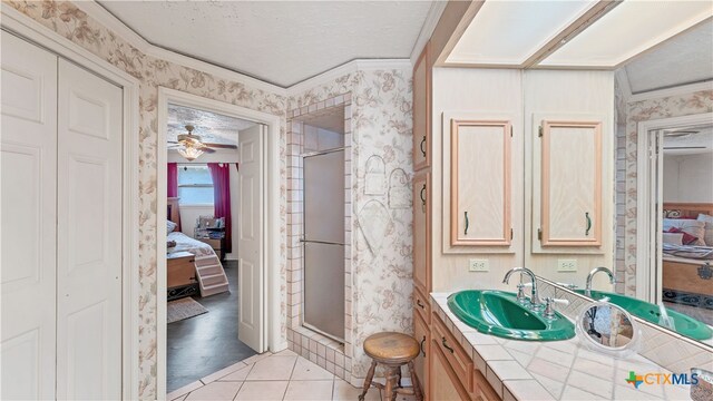 bathroom with hardwood / wood-style flooring, ceiling fan, an enclosed shower, and crown molding