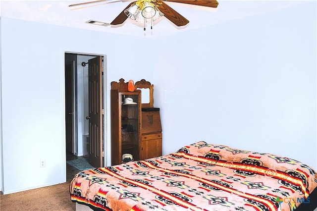 bedroom featuring visible vents, carpet, and ceiling fan