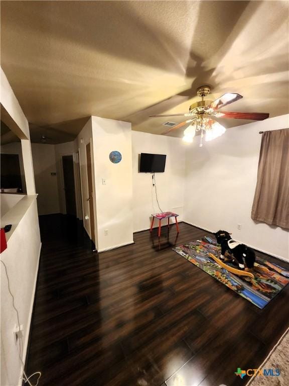 1402 Fox Creek Dr, Killeen, TX 76543 - unfurnished living room with a ceiling fan, visible vents, and wood finished floors