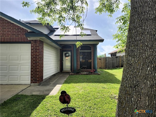 1402 Fox Creek Dr, Killeen, TX 76543 - exterior space featuring fence, a garage, a front lawn, and brick siding