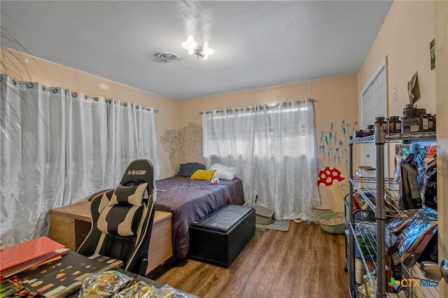 bedroom with wood-type flooring