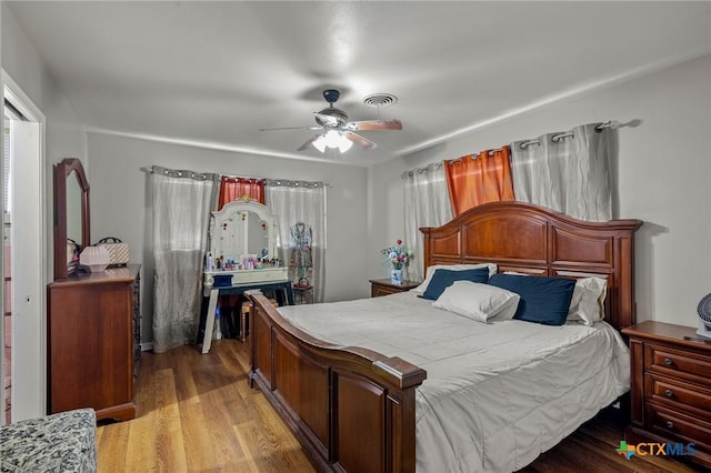 bedroom featuring ceiling fan and light wood-type flooring