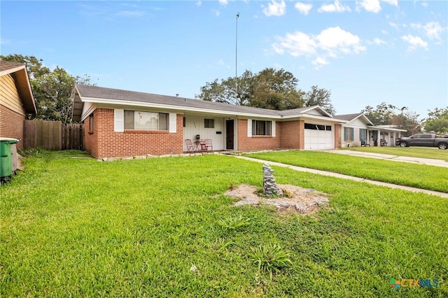 ranch-style house with a garage and a front yard