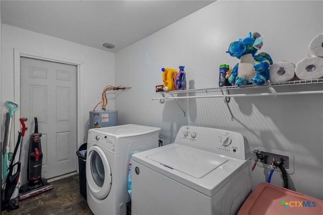 clothes washing area with water heater and washing machine and dryer