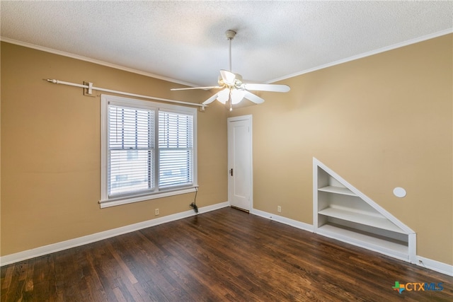 unfurnished room with ceiling fan, a textured ceiling, and dark hardwood / wood-style flooring