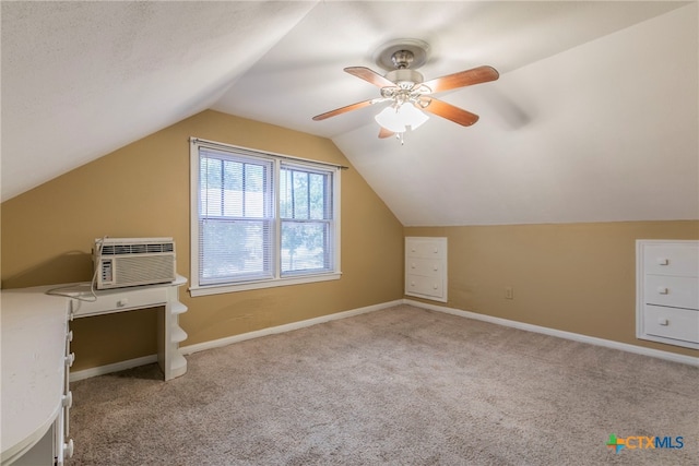 bonus room featuring ceiling fan, a wall unit AC, light colored carpet, and lofted ceiling